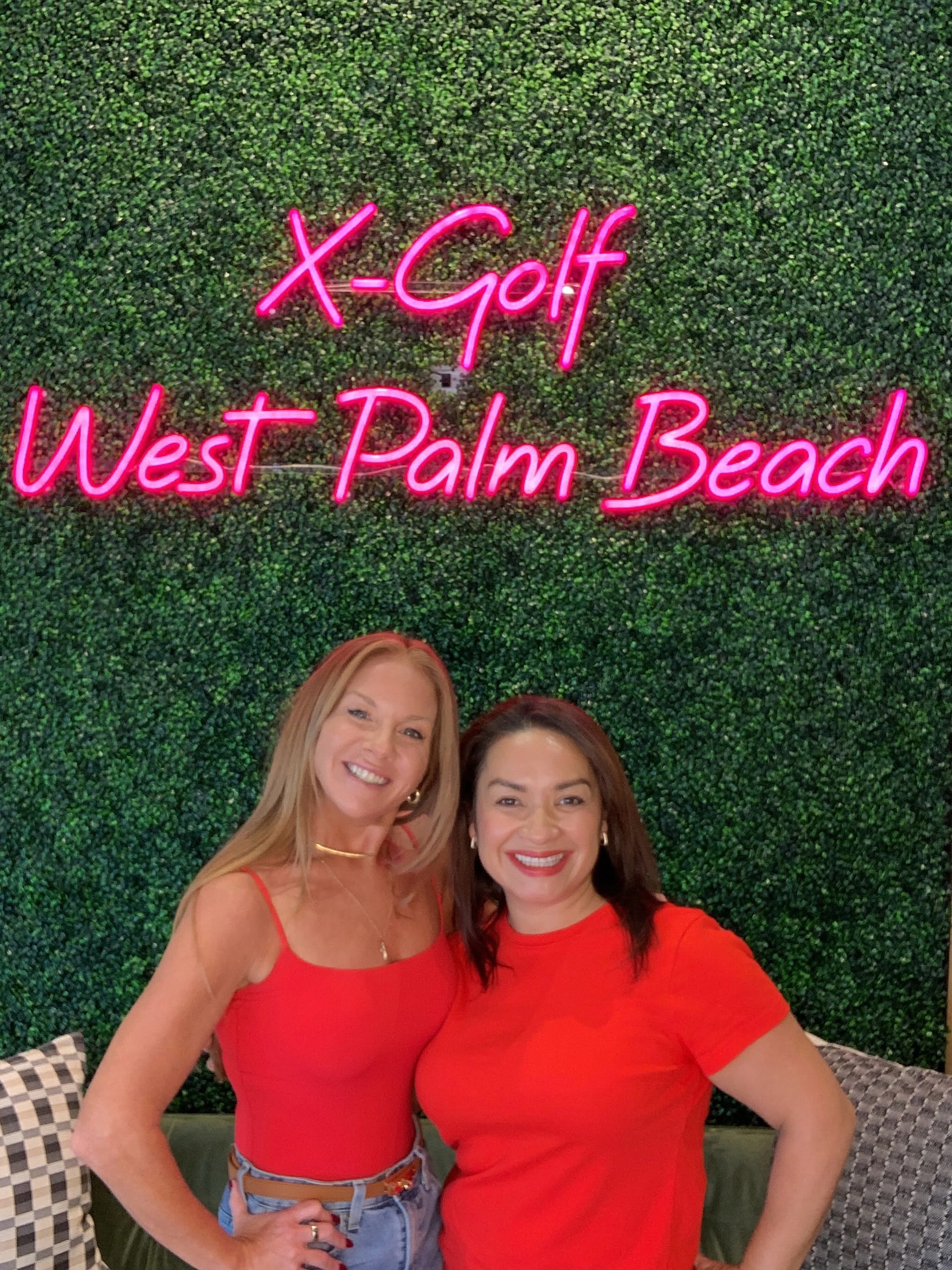 Guests having fun at X-Golf West Palm Beach with The Giggle Booth