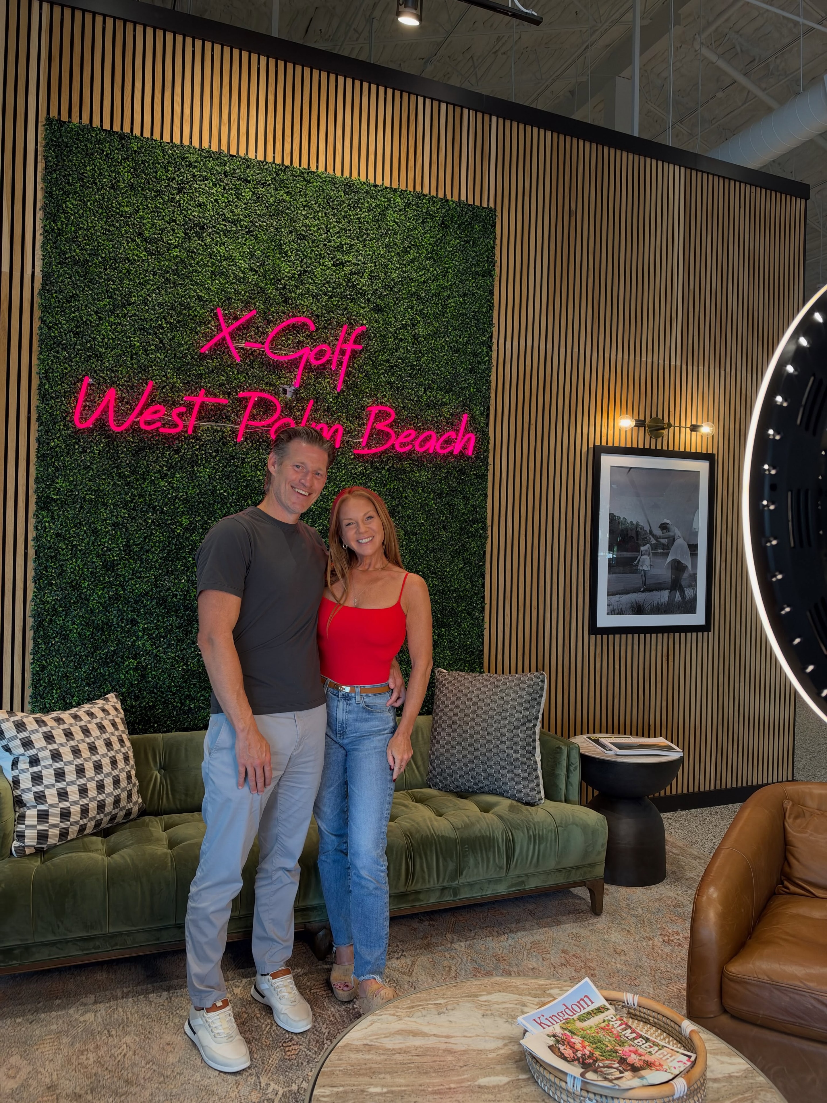 Couple posing with The Giggle Booth at a corporate event